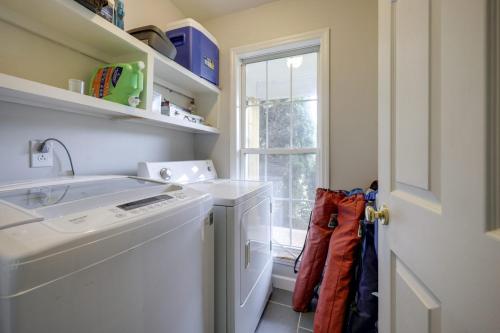a laundry room with a washer and dryer and a window at Vacation N the Station Spacious Cozy 3 bed in Thompsons Station