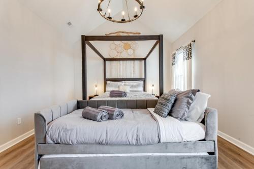 a bedroom with a large bed with a large mirror at Vacation N the Station Spacious Cozy 3 bed in Thompsons Station