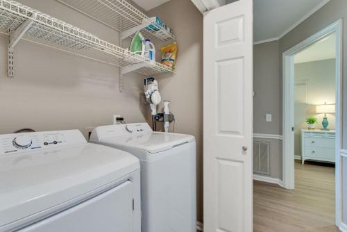 a white laundry room with a washer and dryer at Sunset Stay Pet Friendly 2bed 1 bath in Murfreesboro