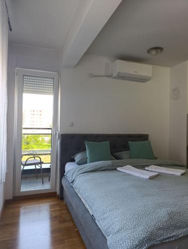 En eller flere senge i et værelse på Apartman Dunja