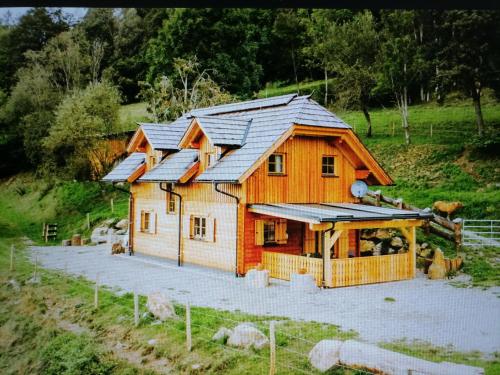 a house with solar panels on top of it at Lärchenhaus ,,Unterer Brodl" in Kammersberg