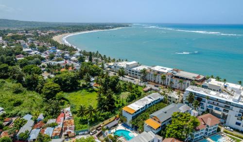 an aerial view of a city and the ocean at Beautifully updated in the heart of town in Cabarete