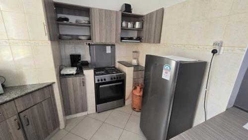 Kuchyň nebo kuchyňský kout v ubytování sunset paradise