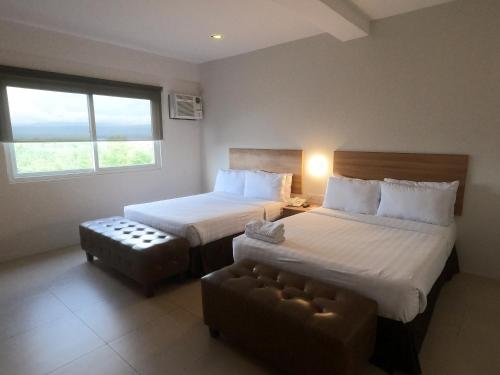 Cama o camas de una habitación en Mango Suites