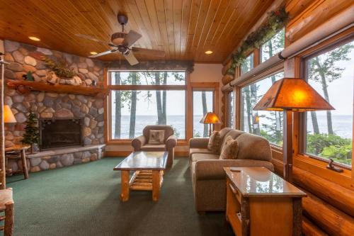 a living room with a couch and a fireplace at Grand Superior Lodge in Castle Danger