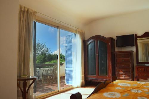 Postel nebo postele na pokoji v ubytování Sandorini Villa for Rent