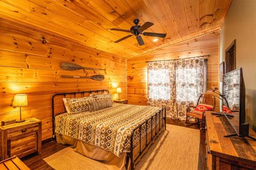a bedroom with a bed and a ceiling fan at Sunset Vista in Bryson City