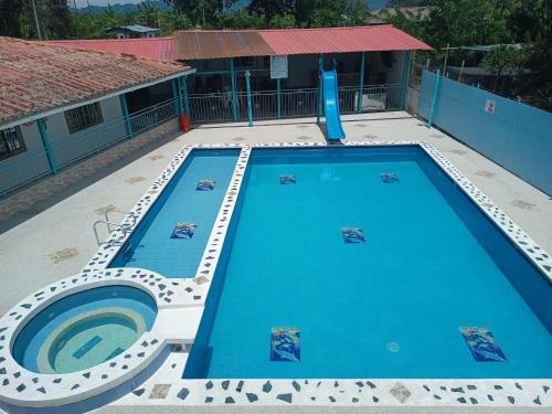 a large swimming pool in a yard at HotelSueños de Acapulco-Eje cafetero-Quindio in Montenegro