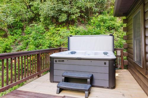 a sink and a stool on a deck at Wally`s Kabin in Whittier
