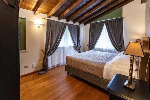 Postel nebo postele na pokoji v ubytování Corte Bioti