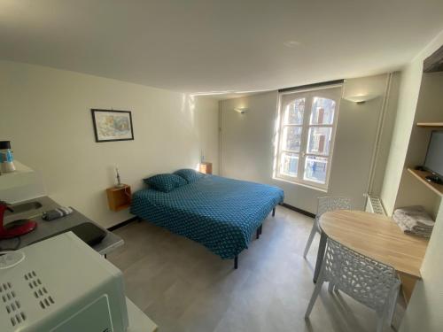 Ένα ή περισσότερα κρεβάτια σε δωμάτιο στο les moulins - studio 7