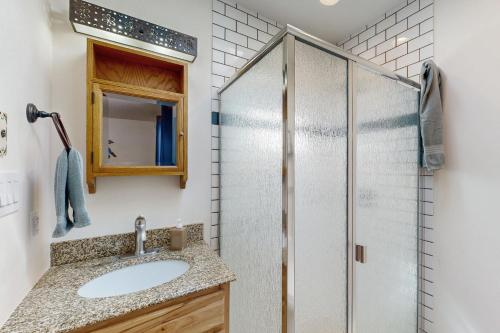 a bathroom with a sink and a shower at Casa Mirador in Santa Fe