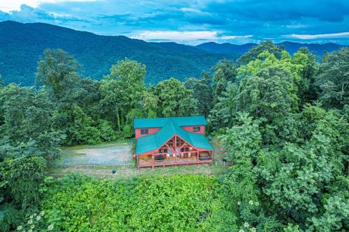 an aerial view of a house with a blue roof at A Bear`s Retreat in Bryson City