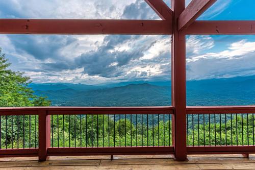 a view of the mountains through a window at A Bear`s Retreat in Bryson City