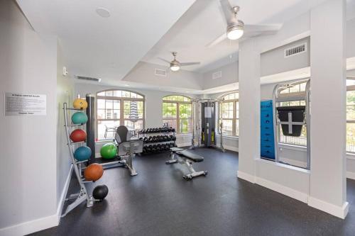 a gym with exercise equipment in a large room at Uptown Elegance Gym, Pool, Wine in Charlotte