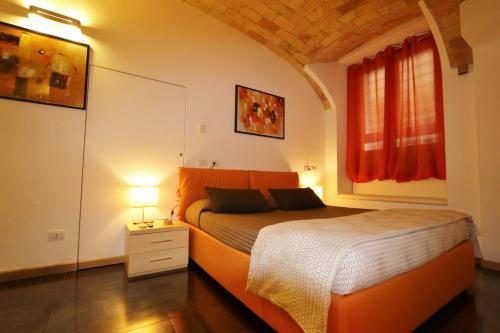 Ένα ή περισσότερα κρεβάτια σε δωμάτιο στο Residenza Adriana