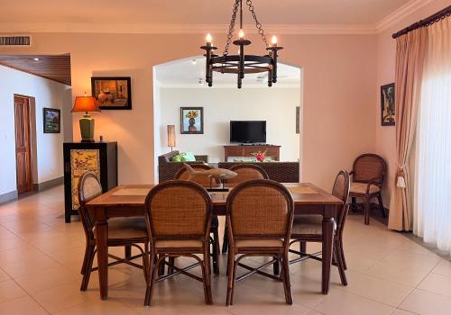 a dining room with a table and chairs at Luxury oceanfront condo, enjoy it ! in Cabarete