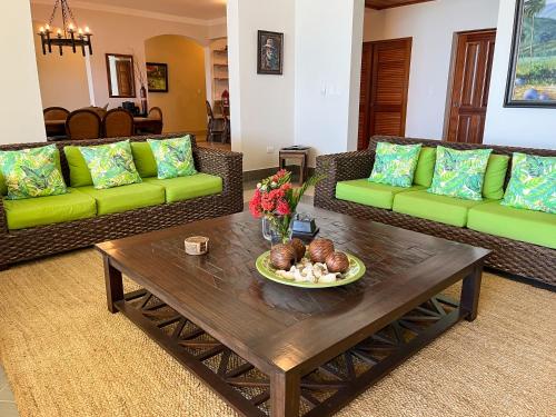 a living room with couches and a coffee table at Luxury oceanfront condo, enjoy it ! in Cabarete
