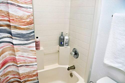 a bathroom with a shower with a sink at Spacious 4-bedroom house with AC, Wi-Fi superb in the Heart of Arlington, TX! in Johnsons Station