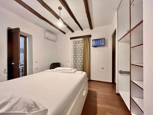 Ένα ή περισσότερα κρεβάτια σε δωμάτιο στο Anói - Renovated Stone House