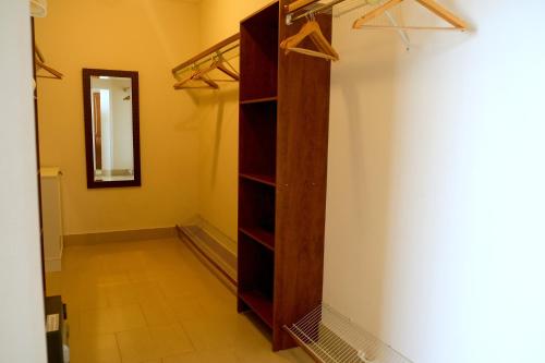 a room with a shelf and a mirror on a wall at Luxury oceanfront condo, enjoy it ! in Cabarete