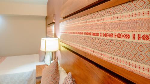 Ein Bett oder Betten in einem Zimmer der Unterkunft Hotel Loma Real