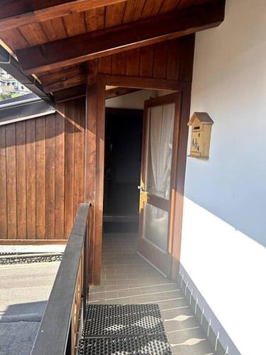 an entrance to a building with a wooden door at La Mansarda di Laura a Danta in Danta