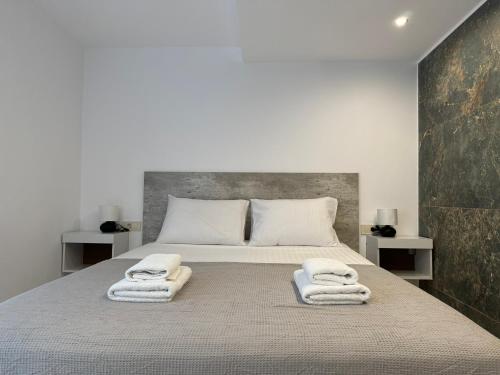 Postel nebo postele na pokoji v ubytování Kasteli Apartment