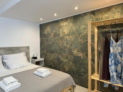 Postel nebo postele na pokoji v ubytování Kasteli Apartment