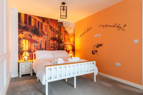 a bedroom with a bed and a painting on the wall at The Voyager in Upton