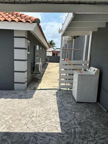 a walkway to a house with a door and a porch at House with pool in Santa Cruz in Santa Cruz