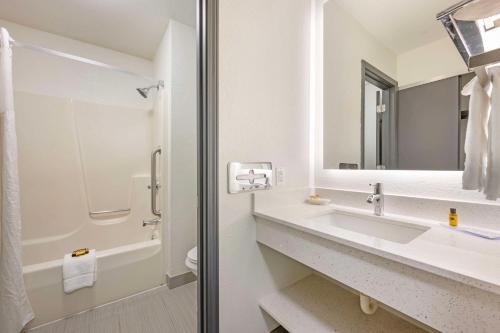 a bathroom with a sink and a mirror at Best Western Plus Anderson in Anderson