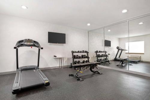 a gym with several exercise bikes and a mirror at Best Western Montgomery I-85 North in Montgomery