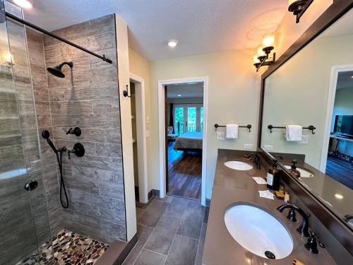 a bathroom with a sink and a shower at C13 Beautiful Bretton Woods ski-in ski-out townhouse for your family getaway to the White Mountains! in Bretton Woods