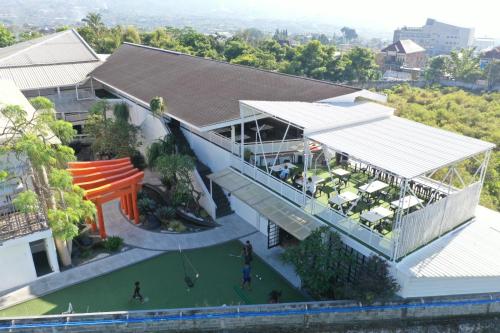 an overhead view of a building with a playground at Kontena Hotel in Batu