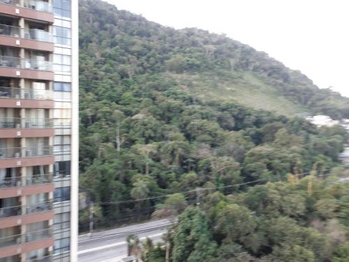a hillside with a road and a building at Via Première - Suíte - Riocentro - Barra Olímpica - Vista Montanha in Rio de Janeiro