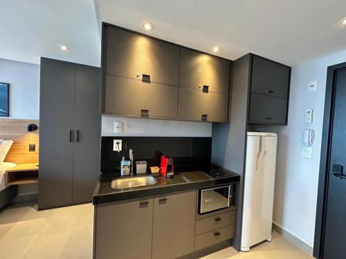 Kuchyň nebo kuchyňský kout v ubytování WAY Tambaú Flat
