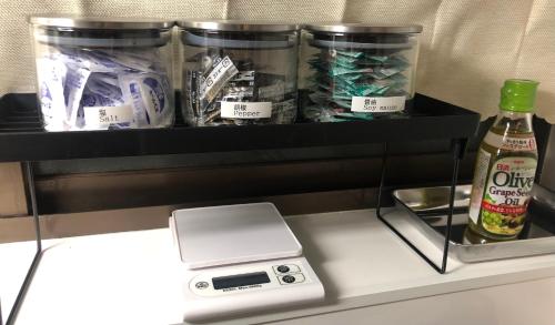 Una cocina o zona de cocina en 民泊ゲストハウス shiamoterrace小田原鴨宮