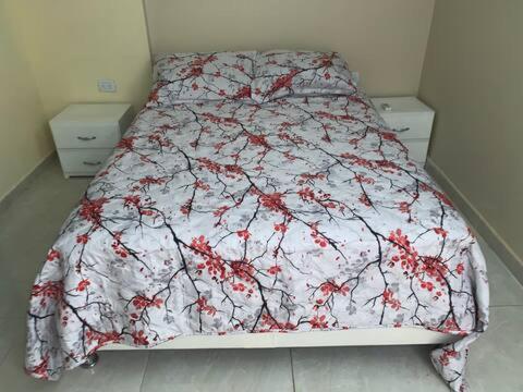 En eller flere senge i et værelse på Hermoso apartamento privado excelente ubicación