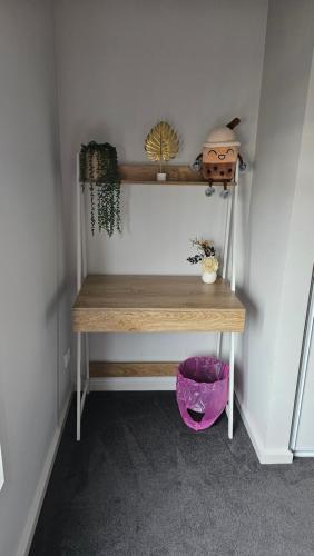 a desk in a room with a purple bowl at Private Master Bedroom with Ensuite in Officer in Officer