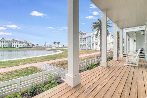 a porch of a home with a wooden deck at La Belle Vue 120 BAR in Mustang Beach