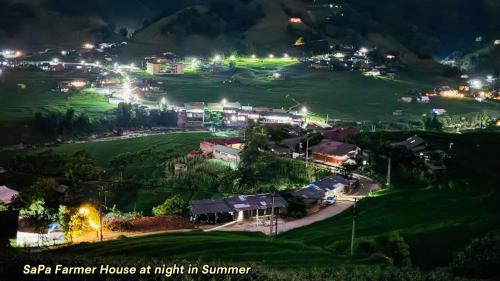 a small town lit up at night in summer at SaPa Farmer House in Sa Pa