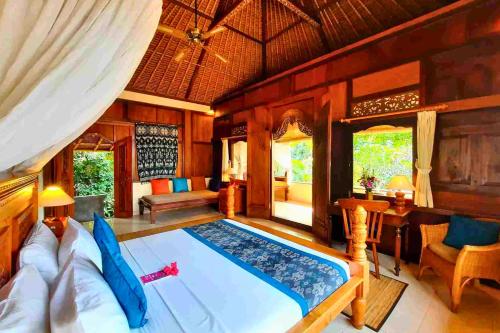 Postel nebo postele na pokoji v ubytování Punita 1 BR Grand Deluxe Garden ZN237