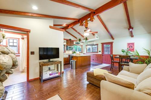 a living room with a couch and a tv at Idyllic Home in Kernville with Private Beach Access in Kernville