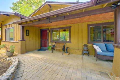 a porch of a house with a blue couch at Idyllic Home in Kernville with Private Beach Access in Kernville