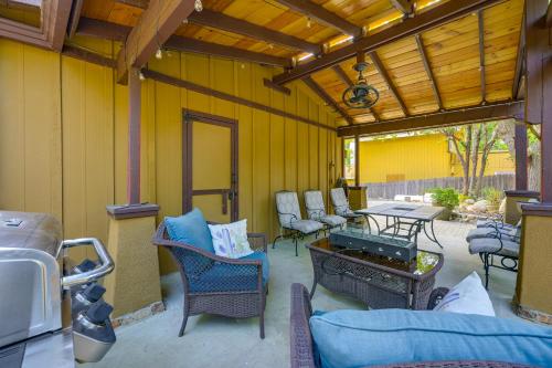 a patio with chairs and a table on a yellow wall at Idyllic Home in Kernville with Private Beach Access in Kernville