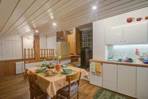 a kitchen with a table with food on it at Ca Contina - Happy Rentals in Frasco
