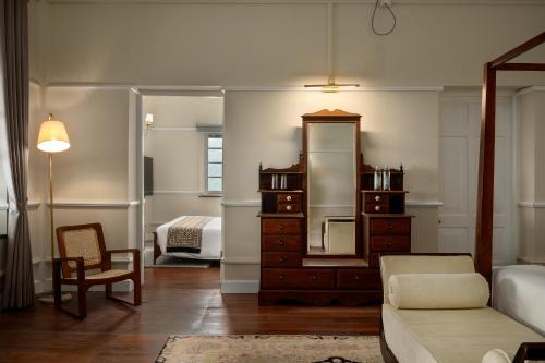 a living room with a dresser and a mirror at Ayr Castle 1922 by Reveal in Padukka