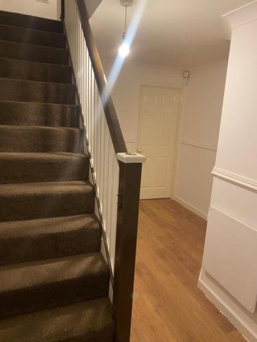 a staircase with a stair light in a room at Jakes hideout at James cook in Middlesbrough