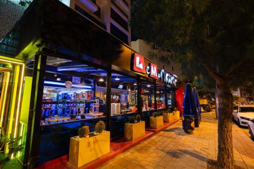 a store front of a bar at night at Leman Otel in Denizli